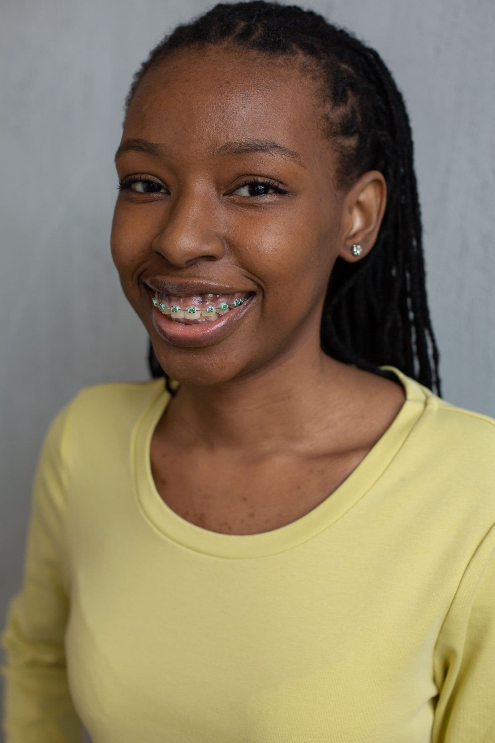 Smiling young woman wearing braces