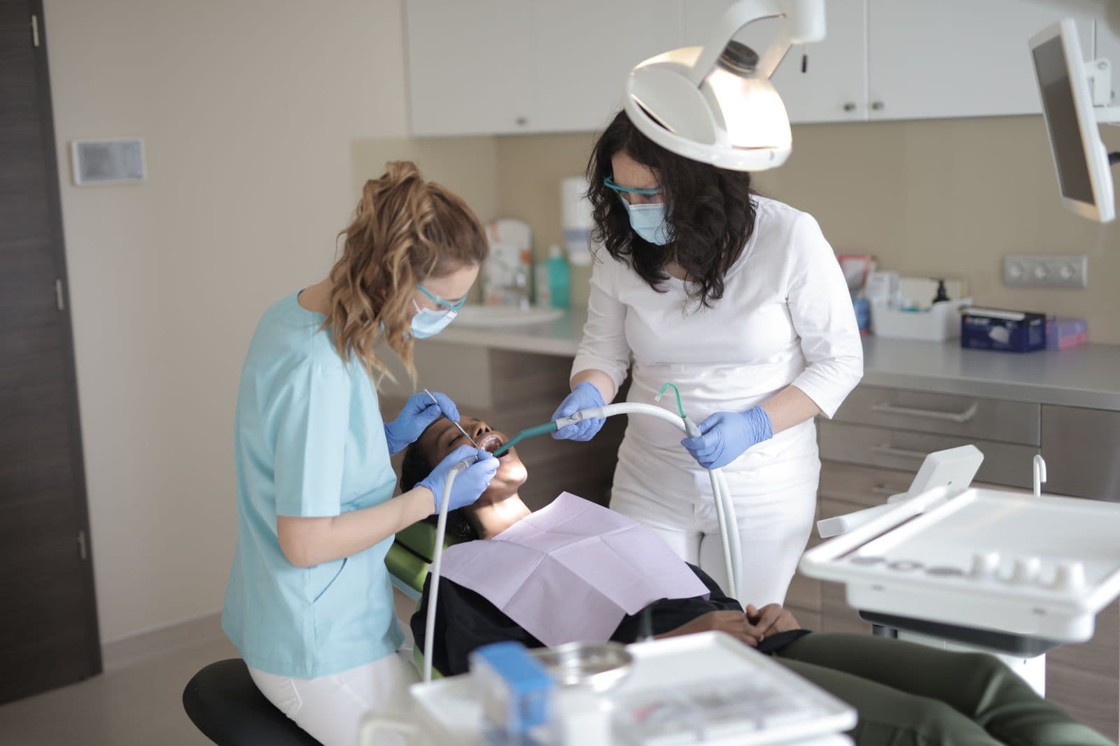Dentist and assistant working chairside